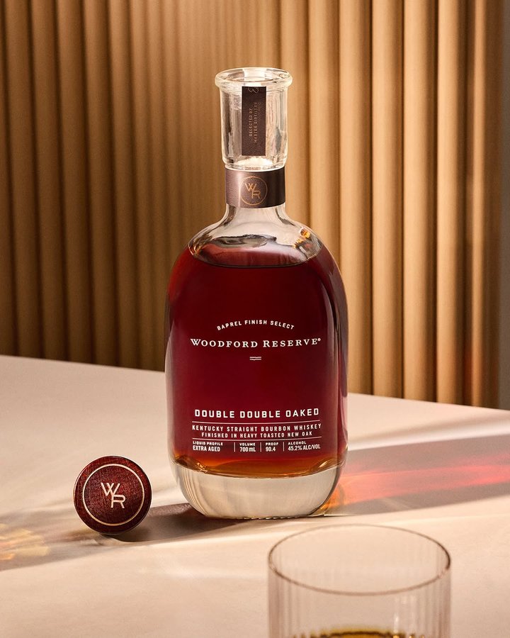 Instagram post by @bourbonenthusiast for Woodford Reserve. Caption reads: Woodford Reserve’s Double Double Oaked Makes....