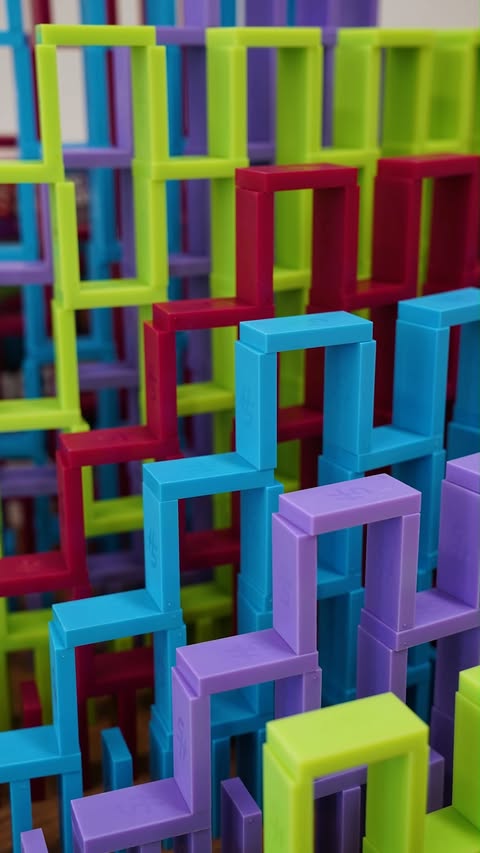 Instagram post by @hevesh5 for Spin Master. Caption reads: Domino speedpyramid reveals something special 😄.