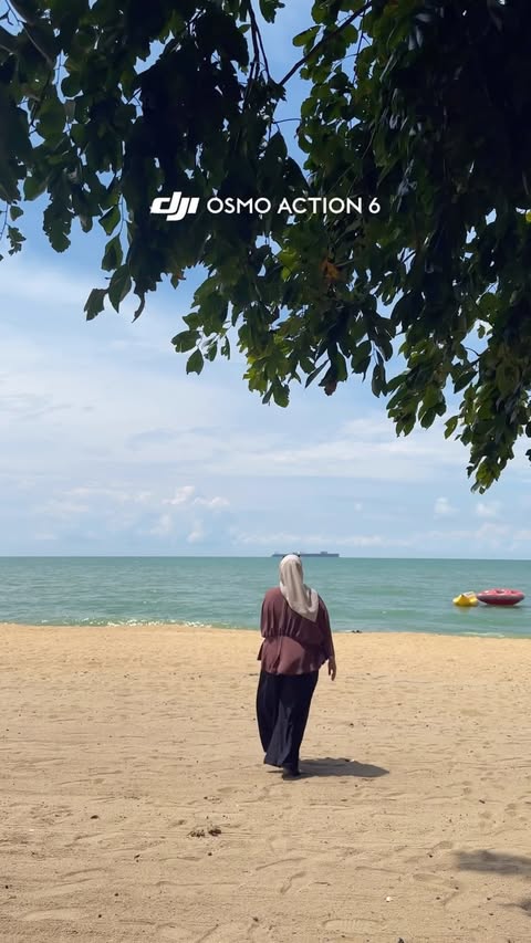 Instagram post by @asyie.ashikin for DJI. Caption reads: [...] just moments worth keeping. 🤍🌊🏖️ #dji....