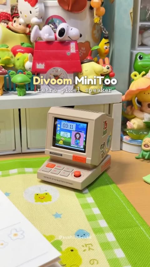 Instagram post by @sushiinosuke for Divoom. Caption reads: my helpful desk buddy: Divoom MiniToo 👾 from....