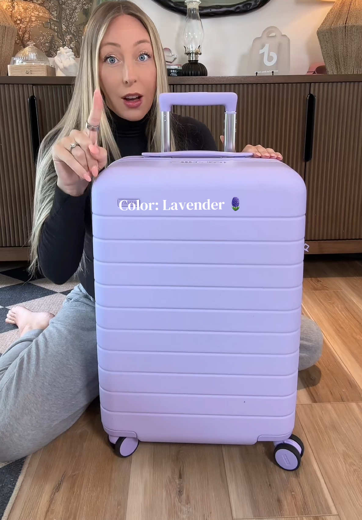 TikTok post by @bestiebriitt for Away. Caption reads: This color 🤩🪻@Away Travel #awayluggage #away....