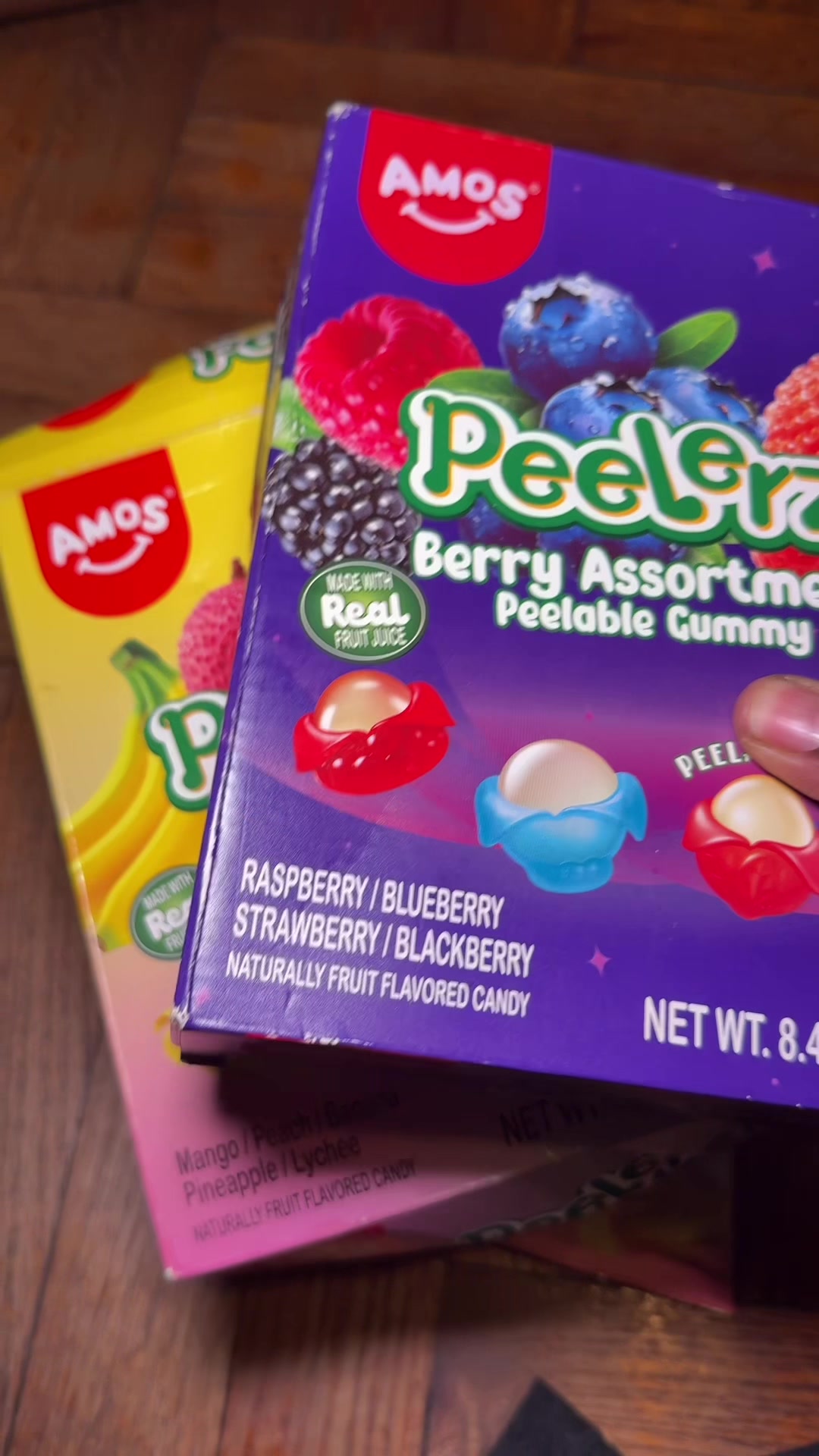 TikTok post by @kyreviews0 for Amos Sweets. Caption reads: These gummies by @Amos Sweets are pretty good!....