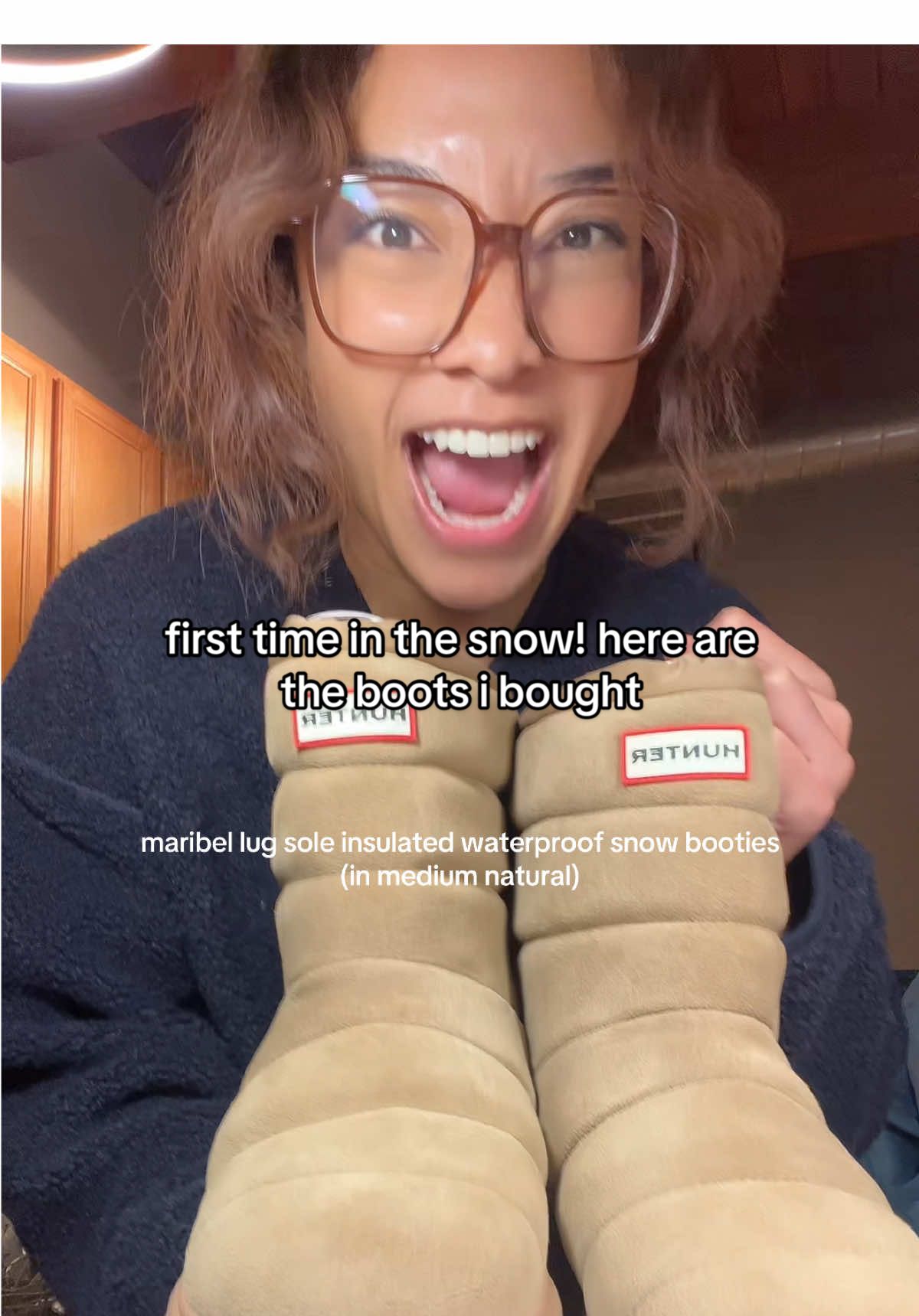 TikTok post by @glowithzo_ for Hunter Boots. Caption reads: [...] #snowboots #chicagowinter #winterfashion....