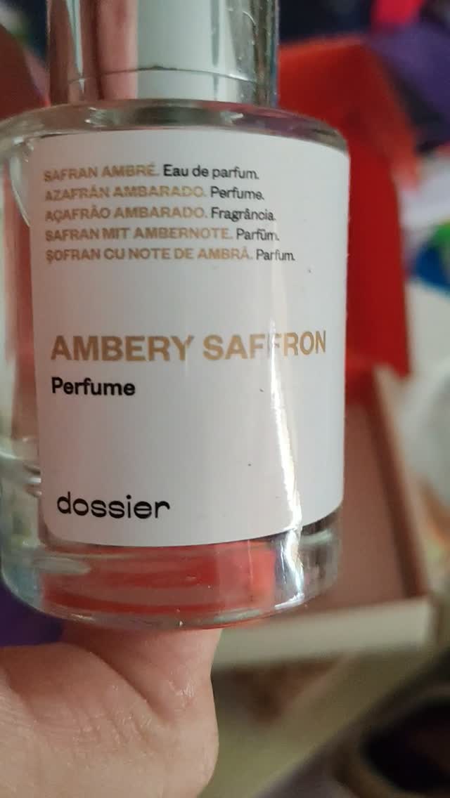 Instagram post by @frannola for Dossier. Caption reads: I tested @dossierperfumes amberly saffron and I....