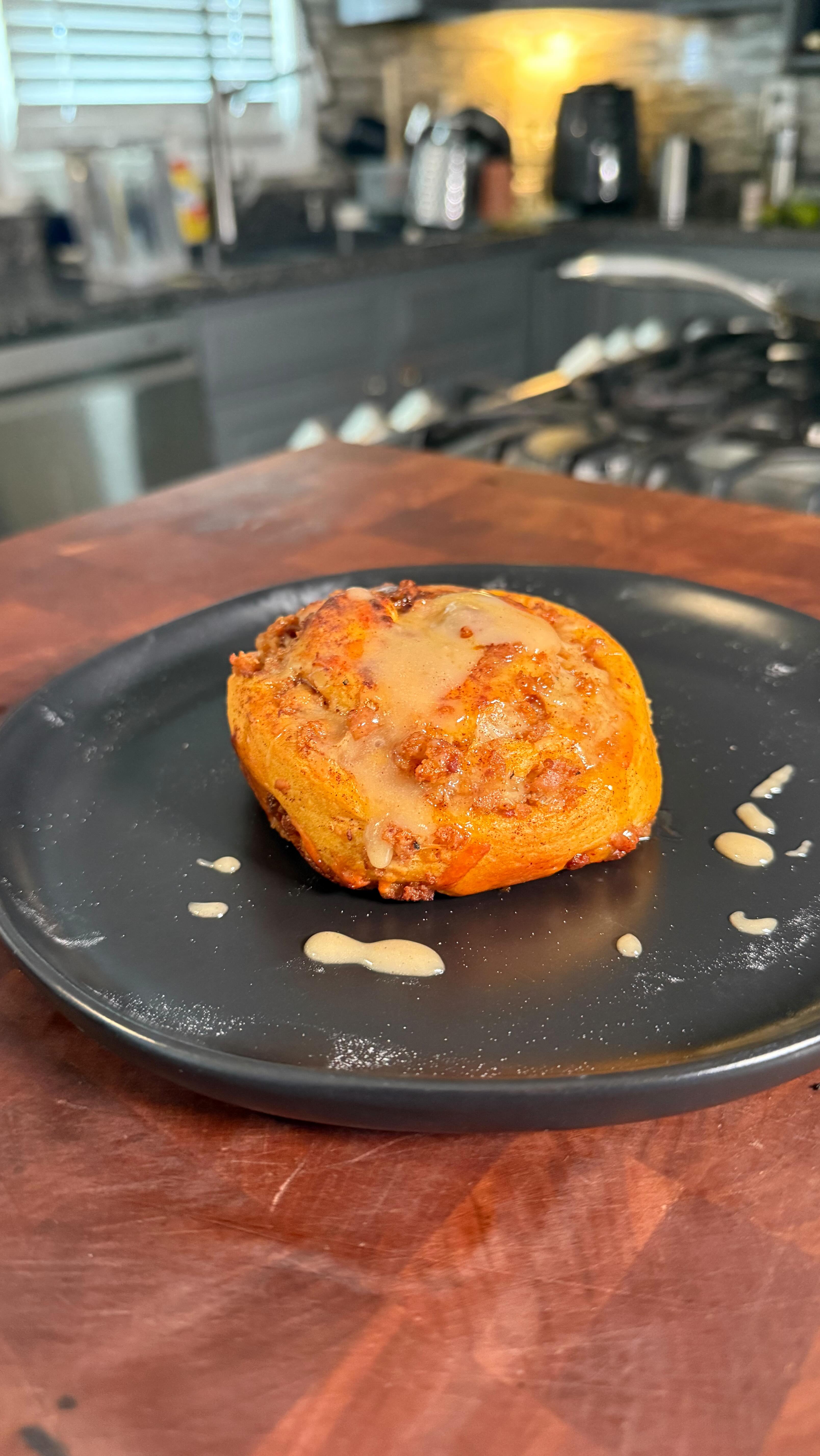 Instagram post by @cookitwithtim for Heath Riles BBQ. Caption reads: Pork Pumpkin Spice Cinnamon Roll Cinnabon style. ....