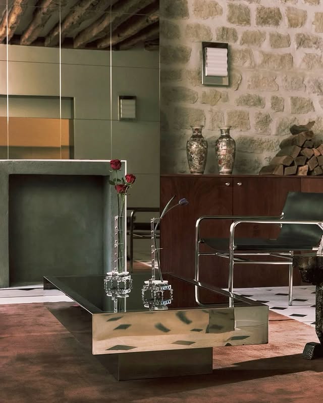 Instagram post by @chiararizzolo for Architectural Digest. Caption reads: A moody palette apartment in Le Marais, where....
