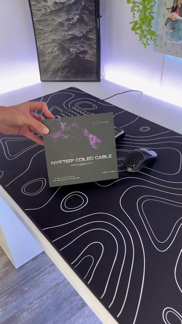 Instagram post by @mathias_shwz for nyfter. Caption reads: ASMR CoiledCable unboxing 💜 @nyfter_ 
#maetztv....