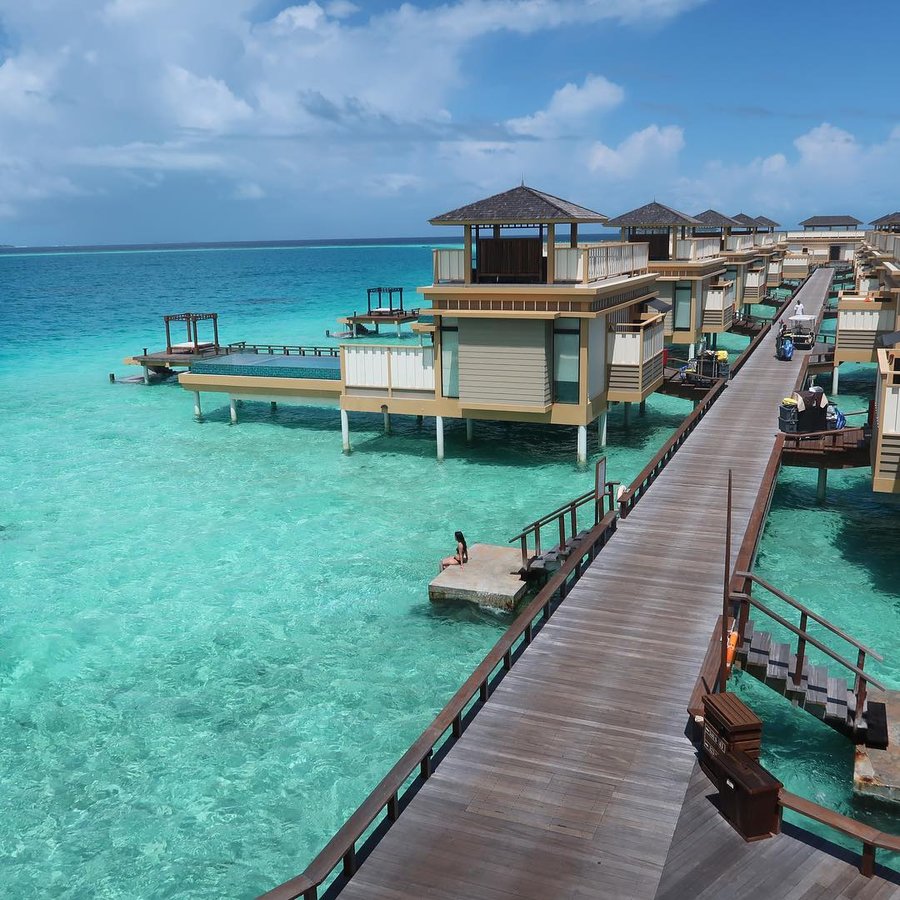 Instagram post by @mancexplores for Condé Nast Traveller. Caption reads: Sitting on the edge of one of my top places to....