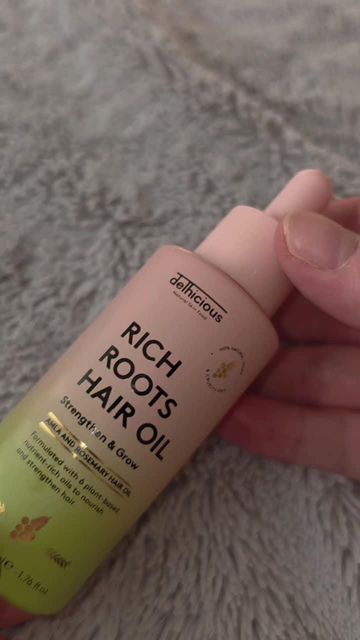 TikTok post by @jordanstretton95 for Delhicious Body. Caption reads: obsessed with the @Delhicious rich roots hair oil.....