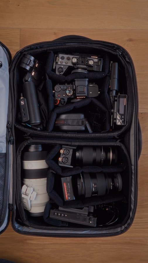 Instagram post by @mariuszgajdzik for Wandrd. Caption reads: What can you pack into the @wandrd Travel Transit....