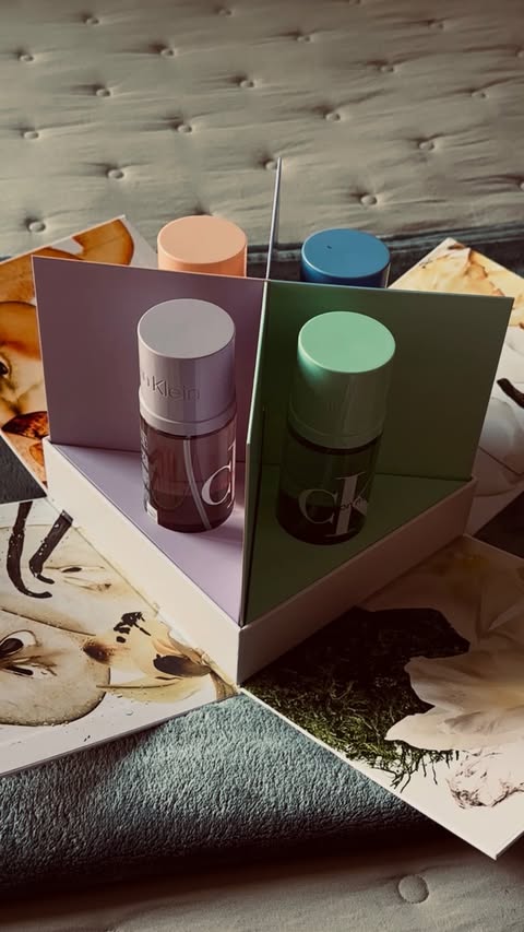 Instagram post by @lanadaoud for Calvin Klein. Caption reads: A mist for every mood 💚💜🧡🩵 @calvinklein....