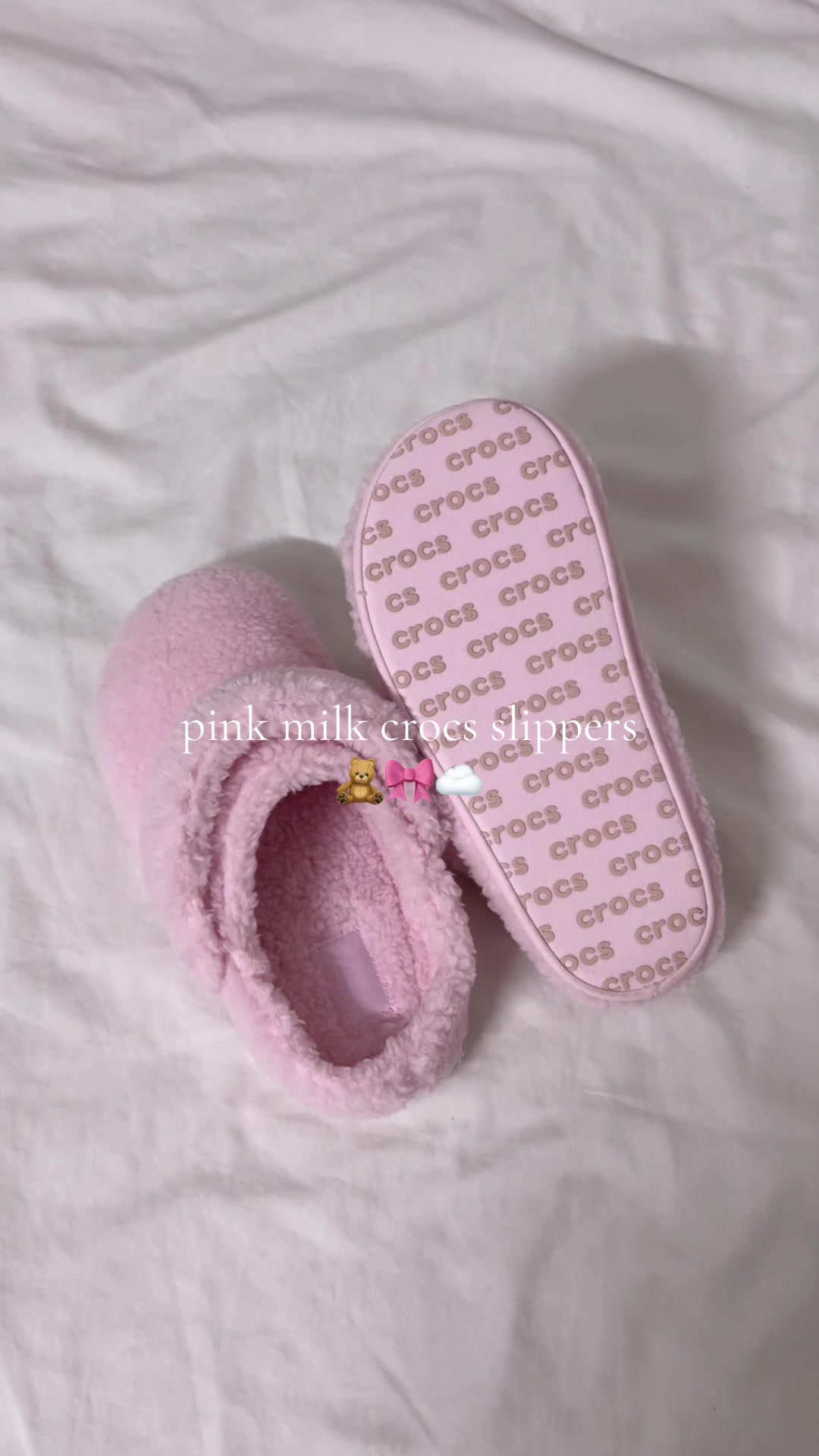 TikTok post by @carewithmi for Crocs. Caption reads: these pink @Crocs slippers are unmatched🧸🎀☁️....