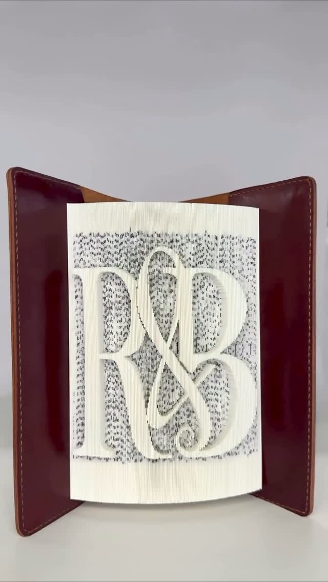 Instagram post by @book_master_official for Russell & Bromley. Caption reads: The new Russell & Bromley monogram, crafted by....