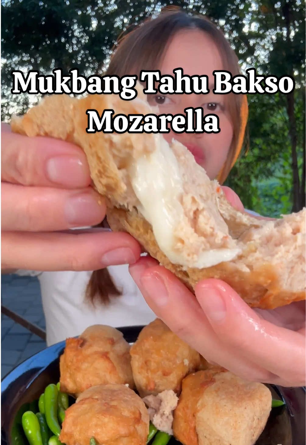 TikTok post by @pia.si.pia for Garnier Indonesia. Caption reads: Makan tahu bakso udang keju mozarella 🫶🏻🫶🏻....