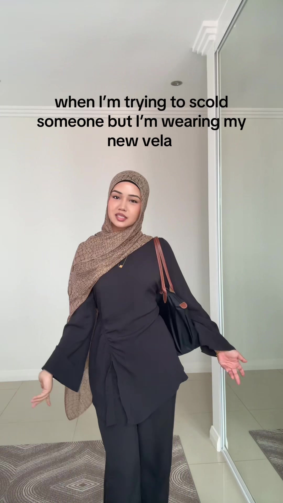 TikTok post by @sanarezz for VELA. Caption reads: forever a printed hijab girly 😝 @velascarves....