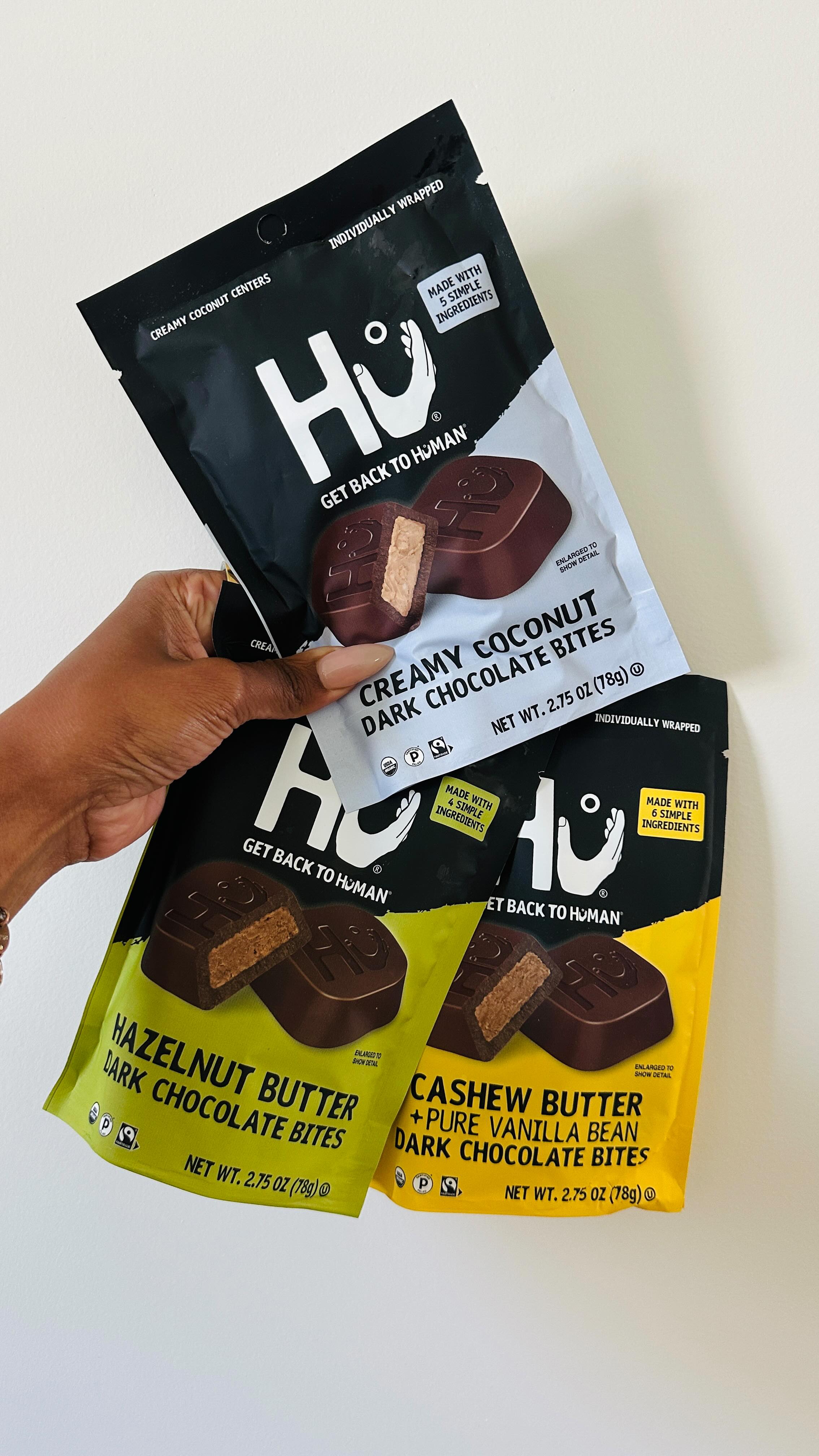 Instagram post by @justaddhotsauce for Hu Kitchen. Caption reads: @hukitchen new dark chocolate bites! perfect for....