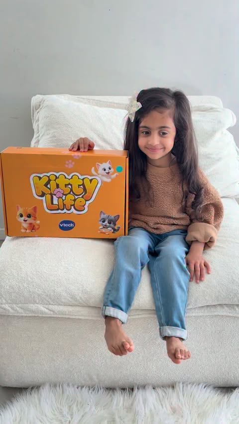 Instagram post by @everyday.biz for VTech USA. Caption reads: Manha is absolutely loving her kitty life from....