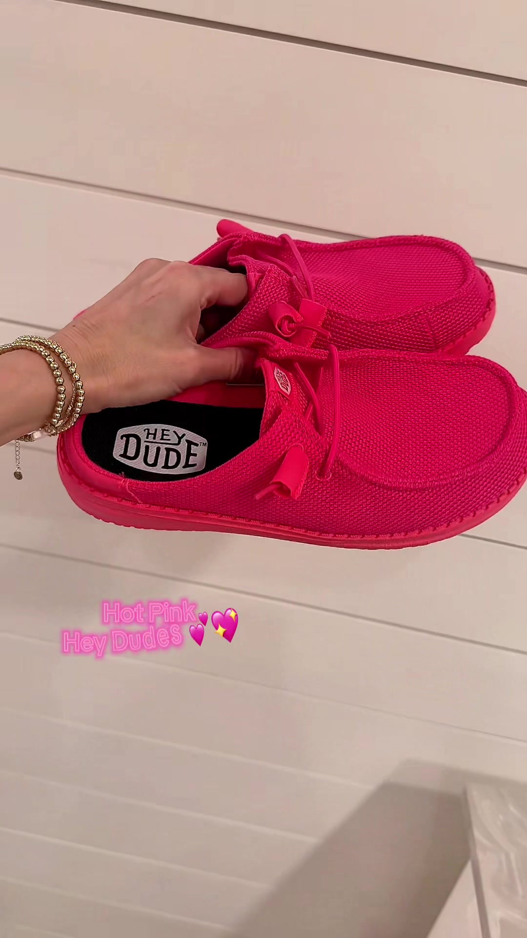 TikTok post by @adrianegweyn for HEYDUDE shoes. Caption reads: Just a tad obsessed 🫶🏽 @HeyDude #heydudeshoes....