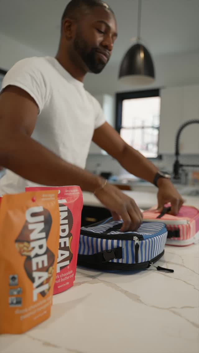 Instagram post by @terrell.and.jarius for UNREAL Snacks. Caption reads: Mornings are wild but never too busy for a snack....