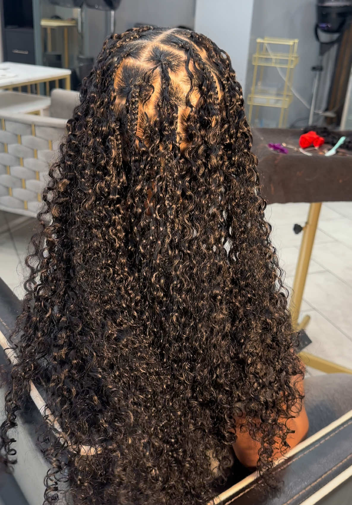 TikTok post by @thehairengineer for Sterly Hair Shop. Caption reads: Definitely Did Their Thing With This Burmese Curly....