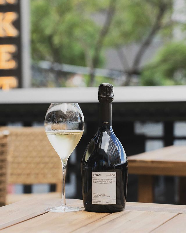 Instagram post by @highlinenyc for Champagne Ruinart. Caption reads: This summer, we proudly celebrate our second year....