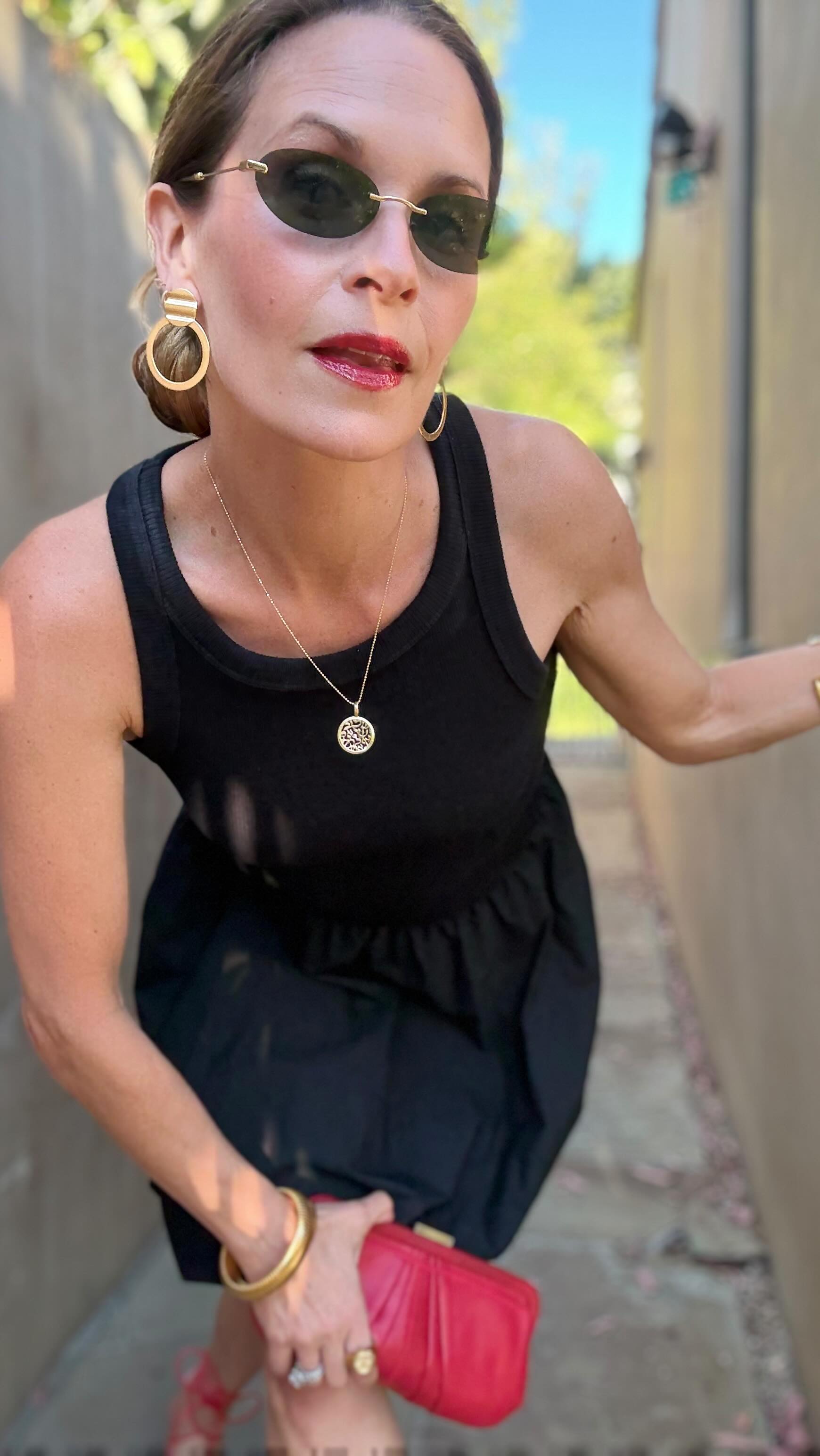Instagram post by @sallypr81 for Larroudé. Caption reads: [...] #redshoes #littleblackdress #larroudepartner.