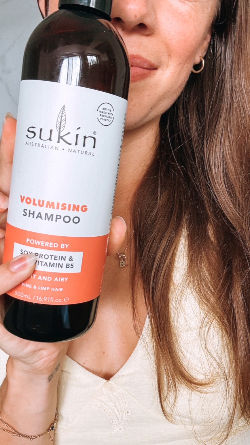 Instagram post by @hayleycarey_ for Sukin Natural Skincare. Caption reads: I lost a lot of hair postpartum and ended up with....