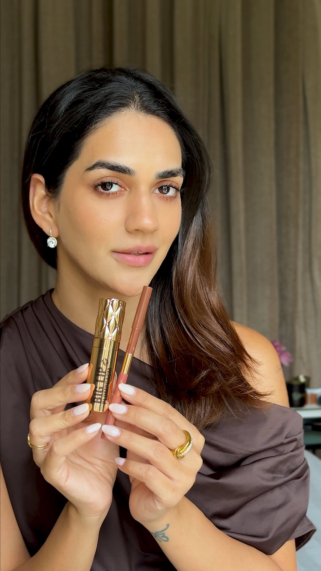 Instagram post by @karmaa.dhingra for Nykaa. Caption reads: Sculpt. Fill. Plump. 💋

Get fuller-looking lips....