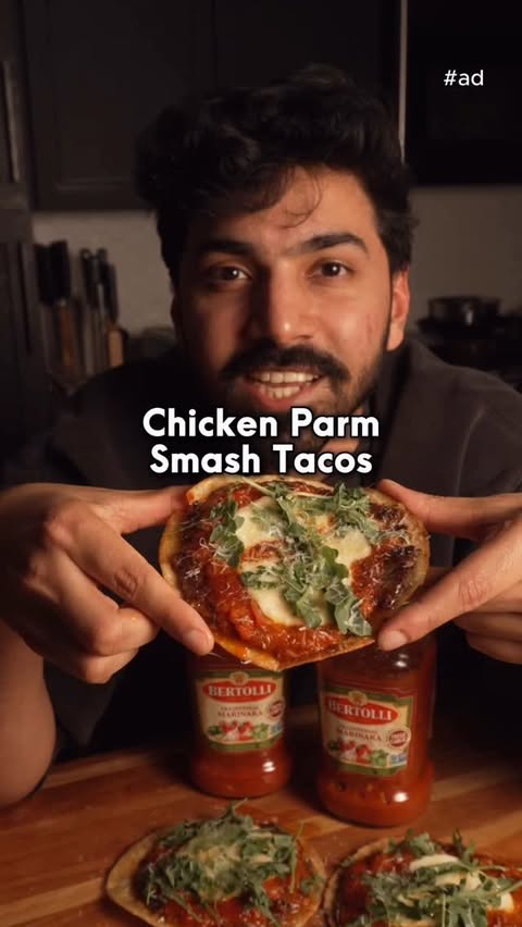 Instagram post by @chefron.cooks for Bertolli. Caption reads: [...] WORK: Smashed Chicken Parm Tacos using....