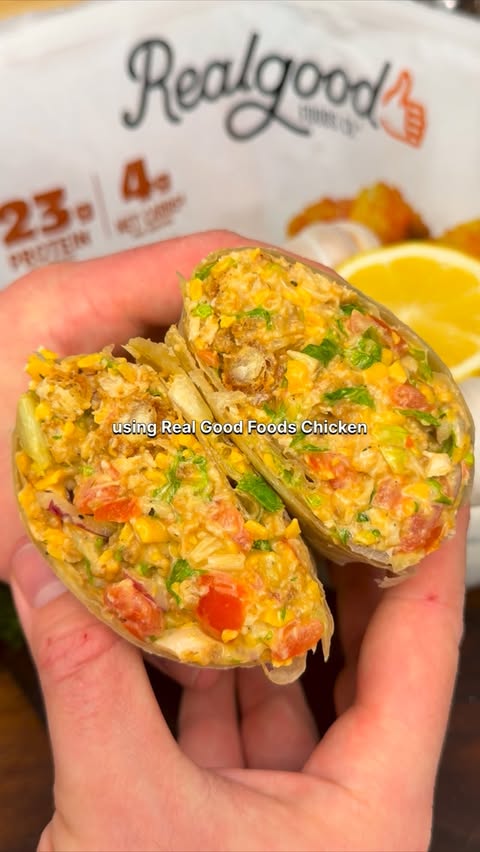 Instagram post by @munchiesbymitchell for Real Good Foods Co.. Caption reads: This Buffalo Ranch Chopped Chicken Salad Wrap is....