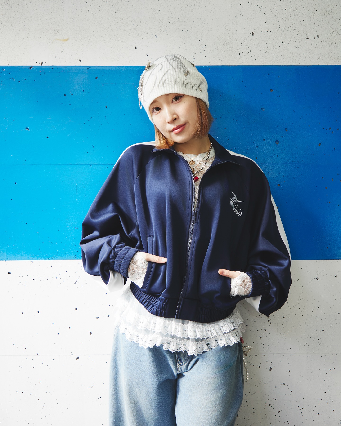 Instagram post by @rena_hattori for MOUSSY. Caption reads: 🤍 @moussyofficial....