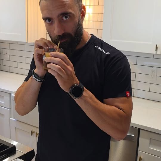 Instagram post by @sakis_karpas for NESCAFÉ. Caption reads: #ad #NescaféAzera | Freddo Espresso στην Αμερική;....