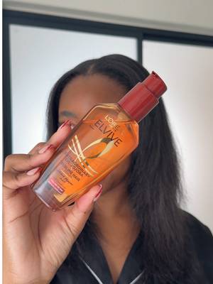 TikTok post by @zecktello_ for L'Oréal Paris South Africa. Caption reads: Recently got my hair silk pressed but wanted more....