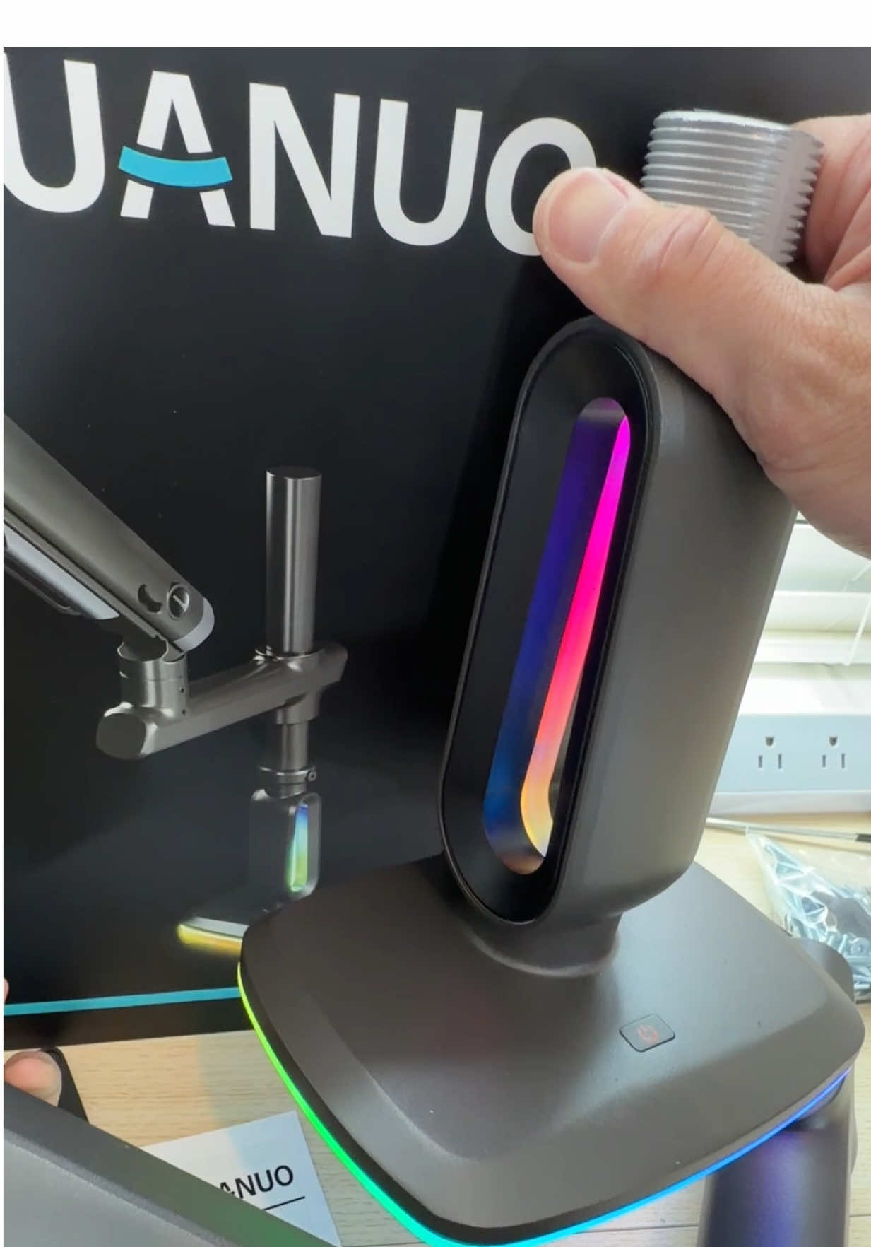 TikTok post by @utechpia.reviews for HUANUO. Caption reads: HUANUO RGB Monitor Arm for 57”! (Affiliate Link)....