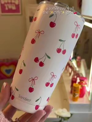TikTok post by @shannnfox for Sandjest. Caption reads: [...] #coffeetok #girlythings #coffeecup @SANDJEST.