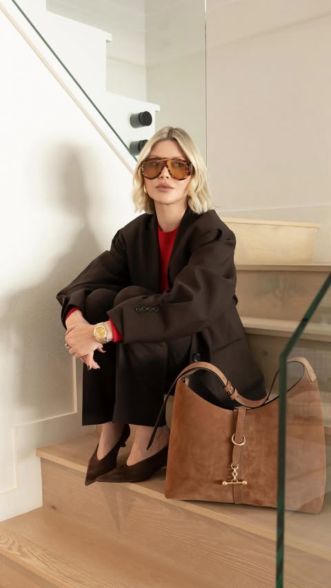 Instagram post by @roses_cloud for Strathberry. Caption reads: Chic, practical, effortless. Meet the new Kite....