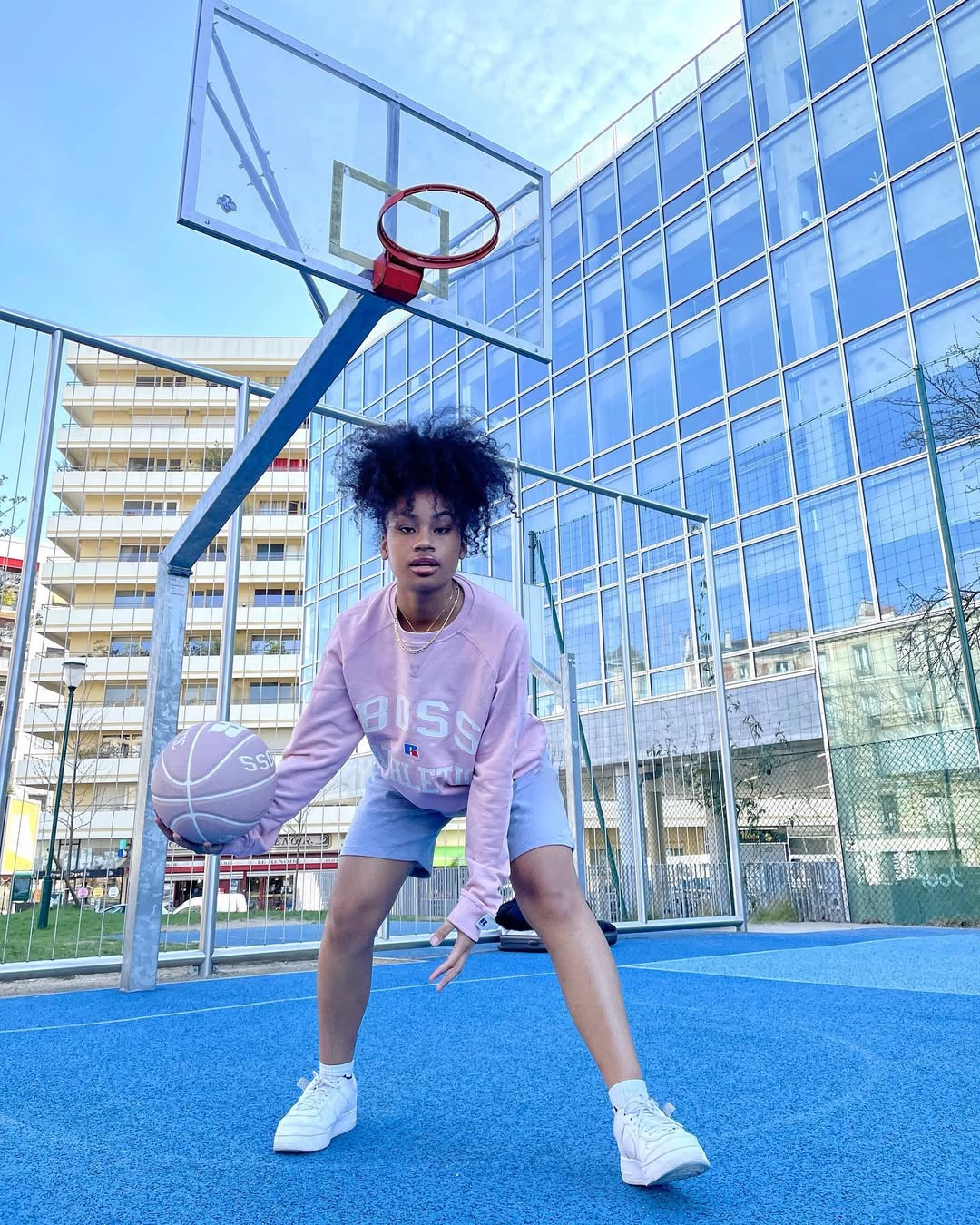 Instagram post by @yva_landria for Russell Athletic. Caption reads: Be your own Boss 🧠

@boss X @russellathletic....