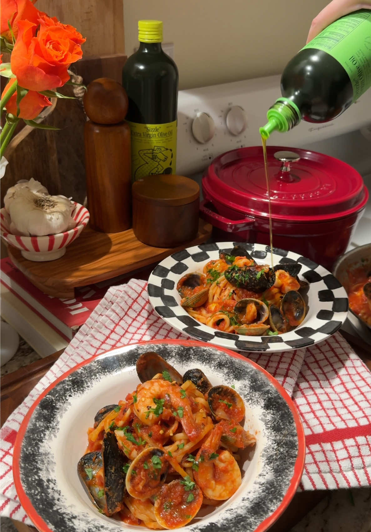 TikTok post by @elizgreaves for Graza. Caption reads: seafood fra diavolo 🦐🍝 made with @Graza Sizzle,....