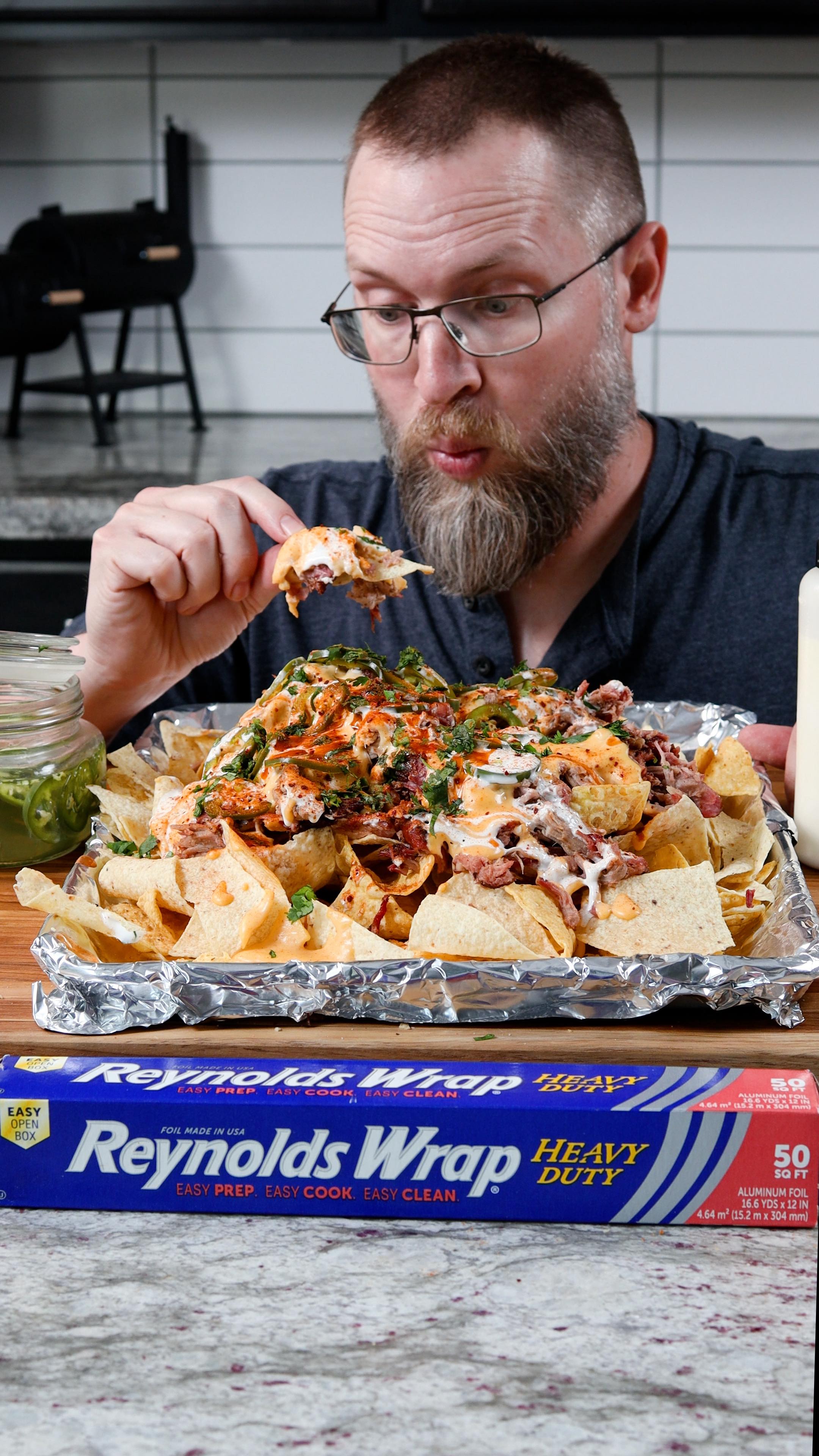 Instagram post by @chilesandsmoke for Reynolds Brands. Caption reads: #ad These were easily the best Smoked Pulled Pork....