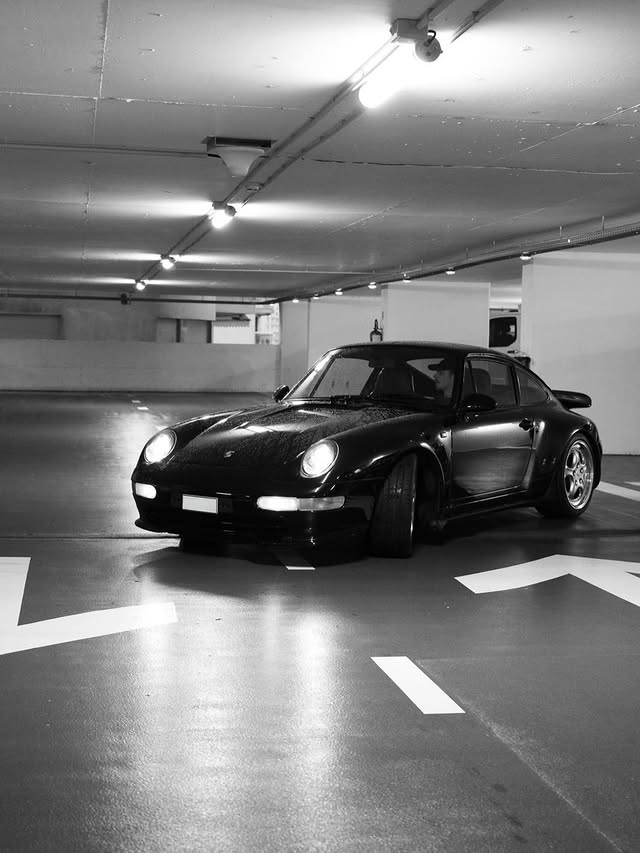 Instagram post by @alexdeminaur for Porsche. Caption reads: [...] constant. Proud to share the road with....