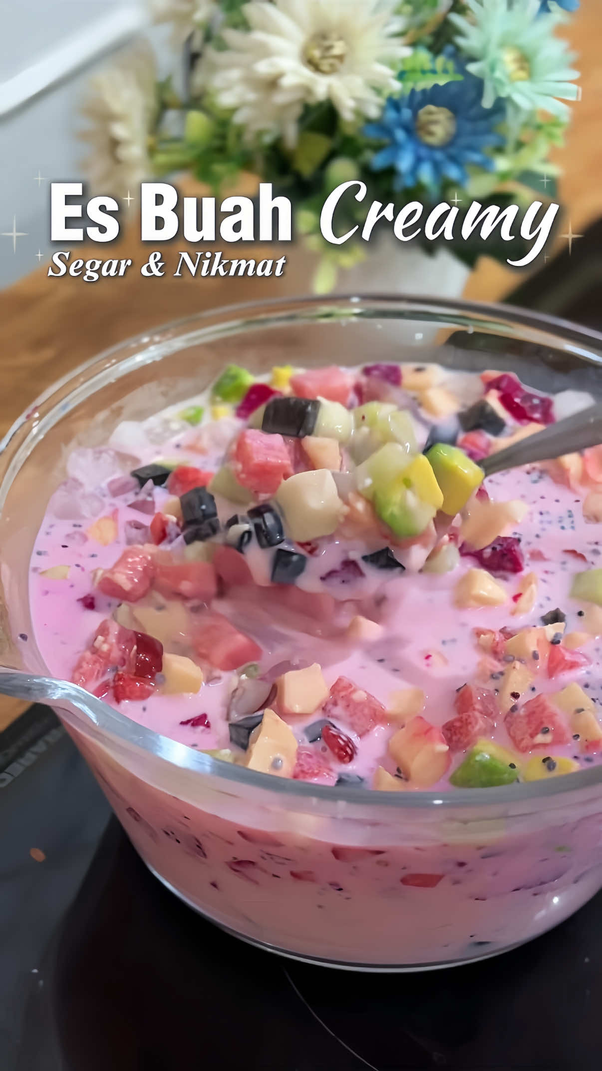 TikTok post by @adeliaazzahra97 for Frisian Flag Indonesia. Caption reads: ✨Es Buah Creamy✨ Cocok buat takjil buka puasa nih....