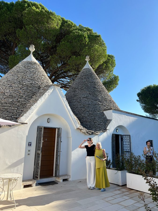 Instagram post by @alexkoekies for UNESCO. Caption reads: Discovering Alberobello in Puglia and its....