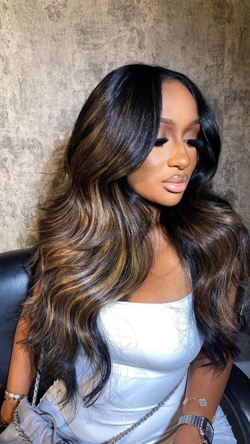 Instagram post by @bysharalaurie for D Hair Boutique. Caption reads: [...] using Raw Malaysian hair from @dhairboutique....