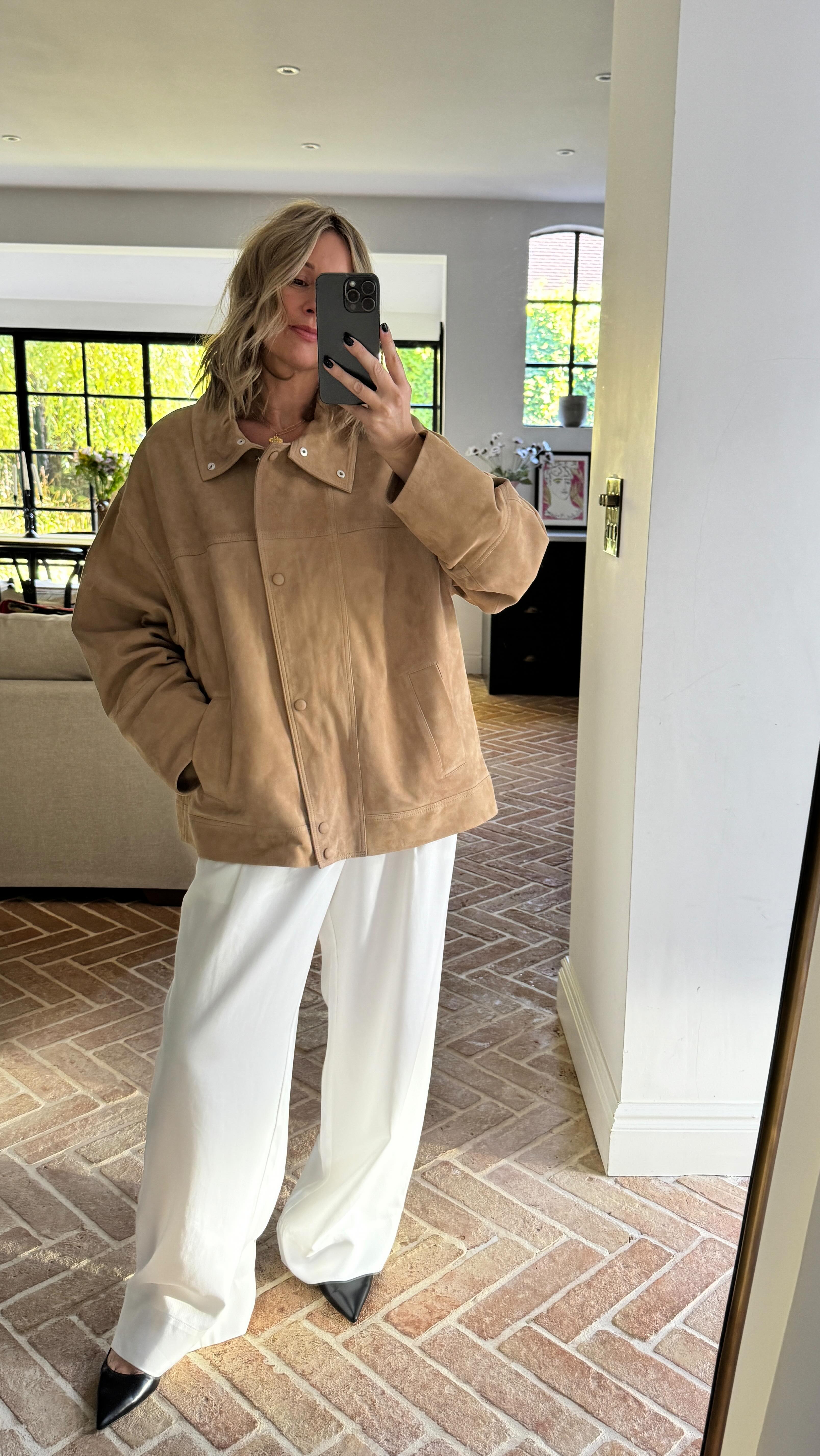 Instagram post by @emmarosethatcher for The White Company. Caption reads: Ad Buttery soft suede and silk for evenings,....