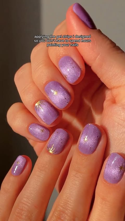 Instagram post by @basecoatstories for Doonails. Caption reads: ad // showcasing: violet visions gel strips 💜🔮✨....