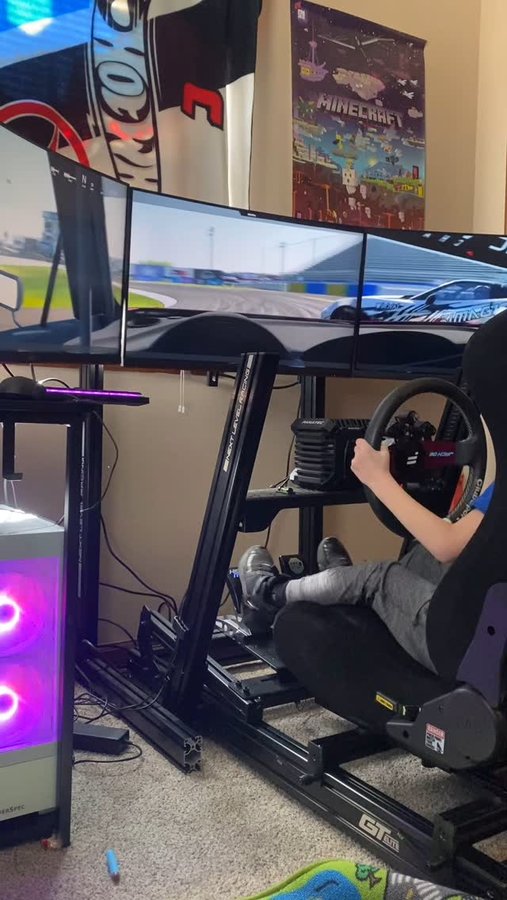 Instagram post by @jack_attack_08 for Fanatec. Caption reads: [...] Cockpit- @next_level_racing Wheel -....