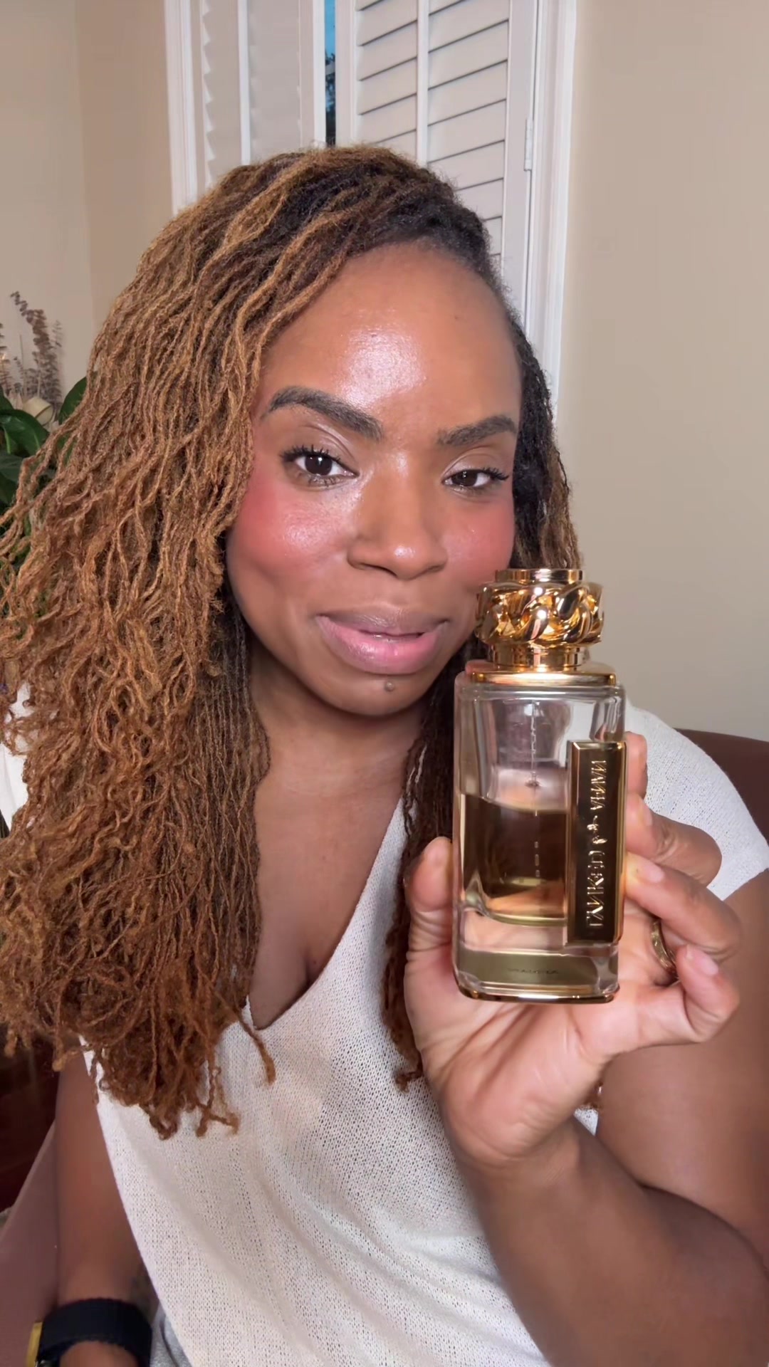 TikTok post by @radiantmay_may for Afnan Perfumes. Caption reads: [...] in this video was purchased by me. @Afnan....