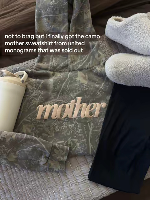 TikTok post by @cassmrslater for United Monograms. Caption reads: [...] the camo “mother” sweatshirt from @United....