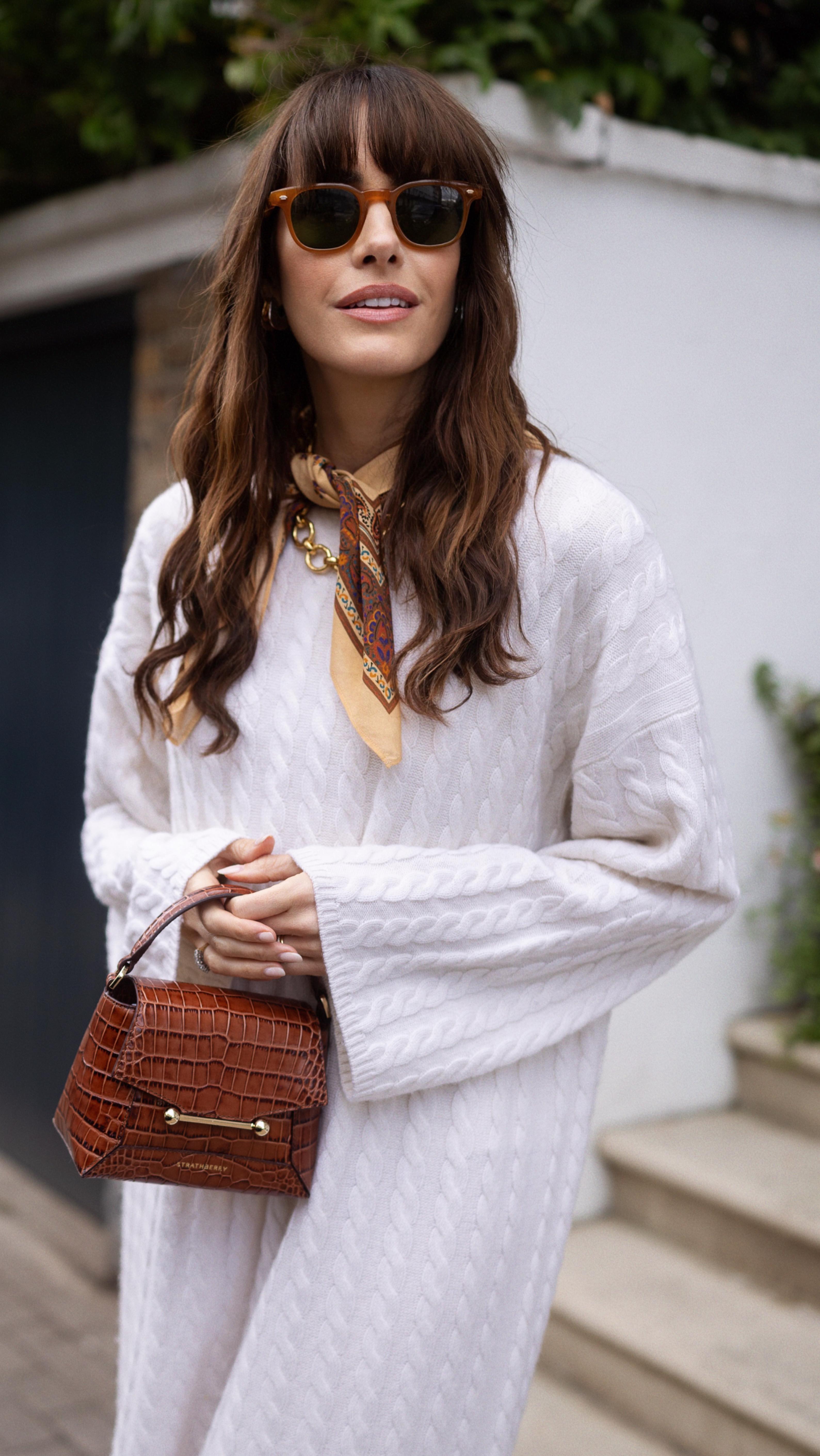 Instagram post by @louiseroe for Strathberry. Caption reads: My cosy & chic day-to-night Autumnal look. And I....