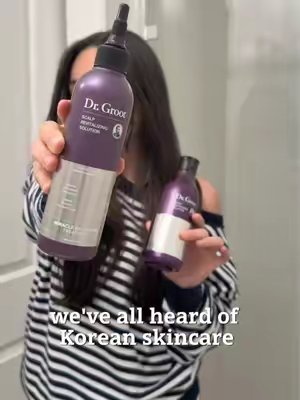TikTok post by @ash.by.the.sea for Dr. Groot Hair. Caption reads: My new wash day duo 🫧🤍 @Dr. Groot Hair available....